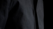 Minimalist chest snap detail with thumb access